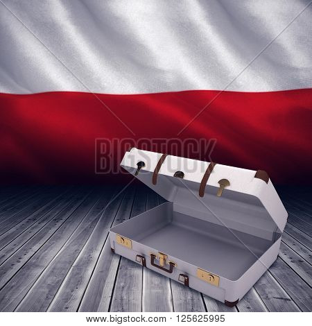 Open suitcase against digitally generated polish flag rippling