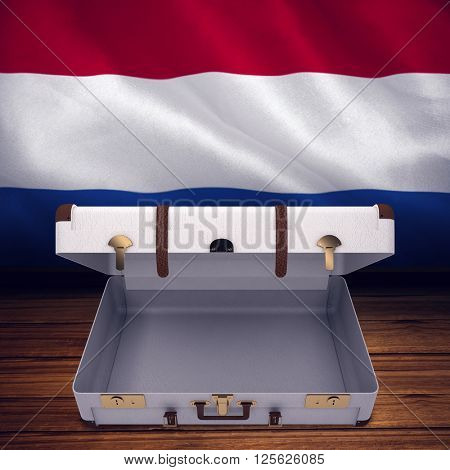 Open suitcase against digitally generated netherlands national flag