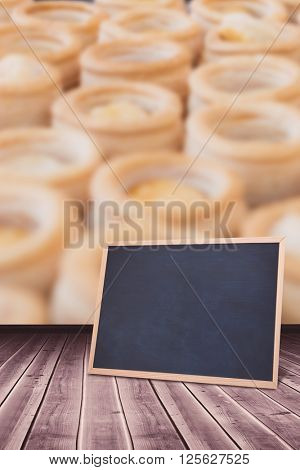 chalkboard against colleagues making vol-au-vent together