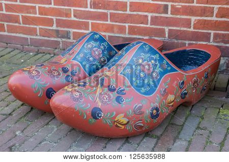 HINDELOOPEN, NETHERLANDS - APRIL 11, 2016: Pair of traditional dutch wooden shoes in Hindeloopen