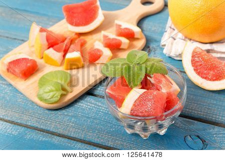 Fresh Oranges And Grapefruit On Wooden Background