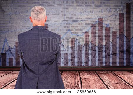 Smiling businesswoman bending against blue data