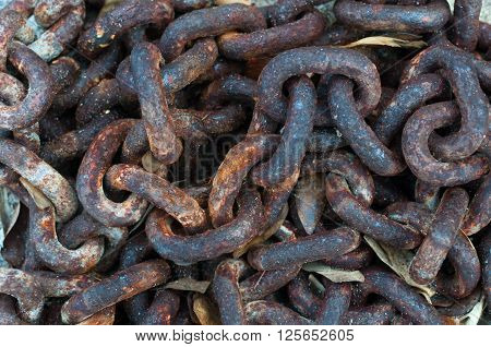 Mass of the old rusty chains. Close up at the worksop