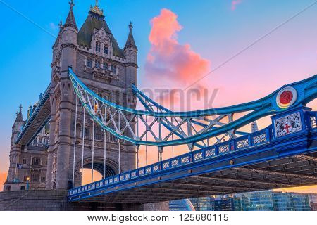 London, UK - March 31, 2016 - Tower Bridge and St. Katharine Pier against pink sunset sky