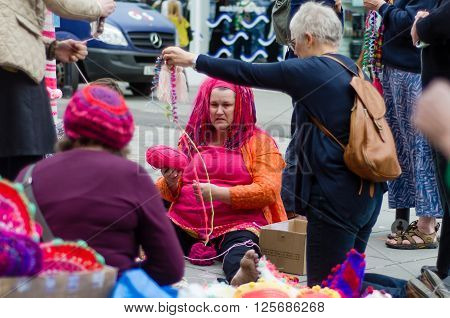 BATH SOMERSET UK - APRIL 14 2016 
Yarn bombing. An organised group cover poles and posts with knitting using wool to brighten up Milsom Street in the city centre
