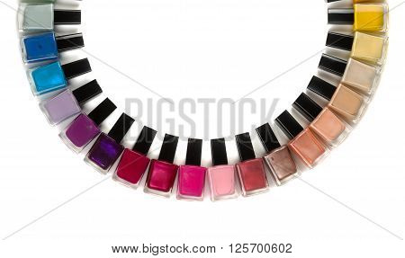 Bottles with nail polish arranged in a semicircle. Isolate on white background.