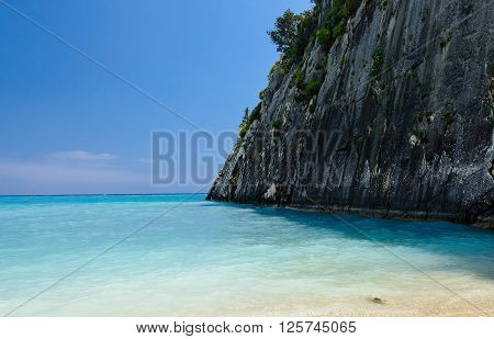 Famous paradise beach Xygia Sulphur. Blue lagoon wide angle view of rocky coast tide blue sky and white sand at Zakynthos island Greece