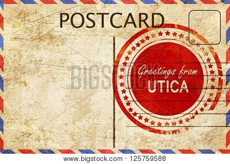 greetings from utica, stamped on a postcard