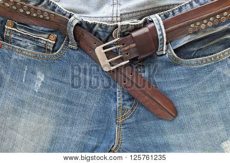 blue jeans with brown leather belt, clothing industry