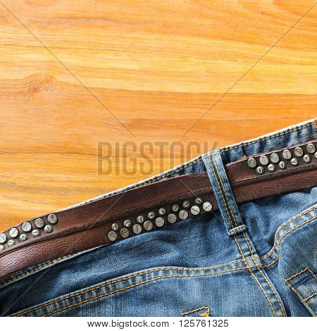 blue jeans with brown leather belt, clothing industry
