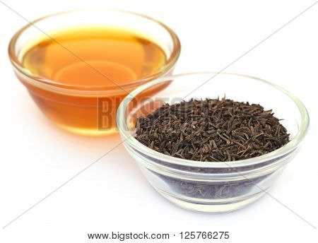 Caraway seeds with essential oil in glass bowl