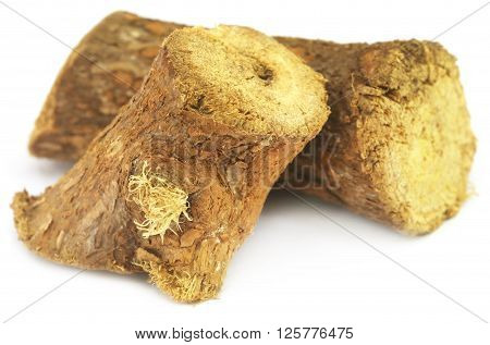 Close up of Medicinal Yastimadhu over white background