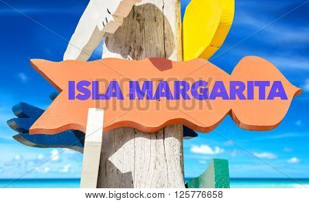 Isla Margarita signpost with beach background