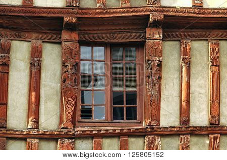 Lannion (Cote-d'Armor Brittany France): facade of old typical half-timbered house: a window