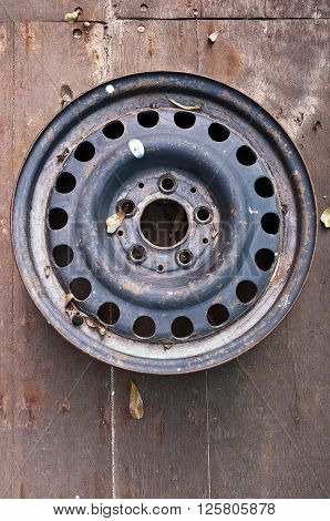 A steel wheel from the front Steel wheel on wood