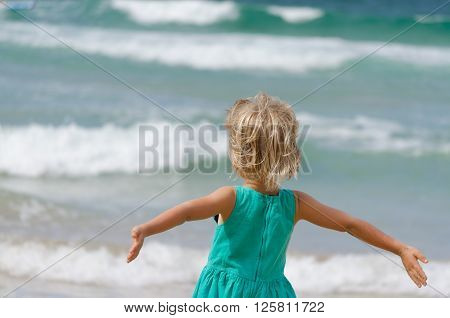pretty girl happy to see the ocean
