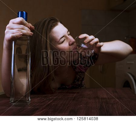 Portrait of desperate and lonely woman holding alcoholic drink. Alcohol addiction.
** Note: Shallow depth of field