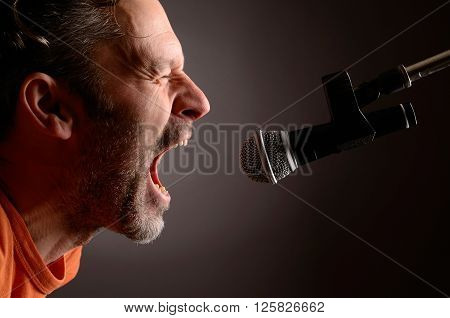 Man with a microphone in a studio