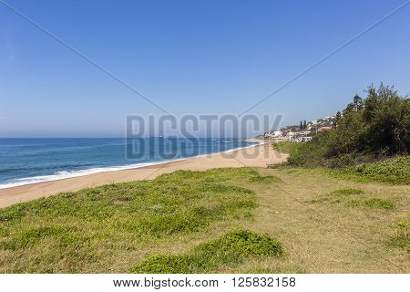 Beach blue ocean water along scenic coastline landscape.