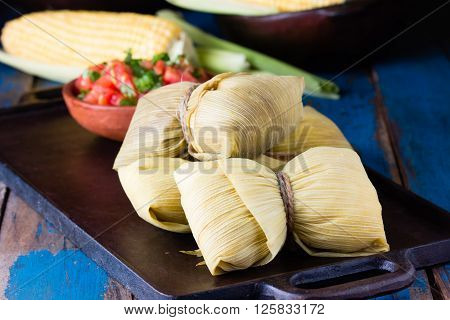 Latin American food. Traditional homemade humitas of corn and leaves