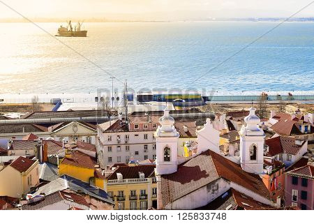 Lisbon coastline with ship at sea at morning