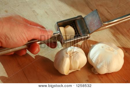 Garlic Cloves In Garlic Press
