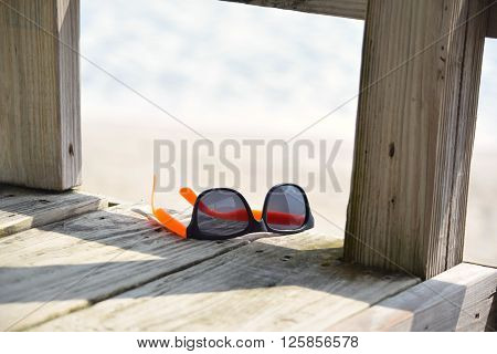 Sunglasses Left Behind on the Beach Boardwalk