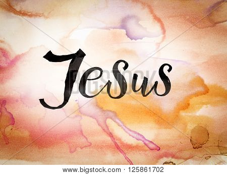 The word "Jesus" written in black paint on a colorful watercolor washed background.