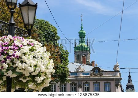 Lviv Ukraine - July 5 2014: Streets in the Old Town. View to Korniakt tower. Lviv historic city center is on the UNESCO World Heritage List