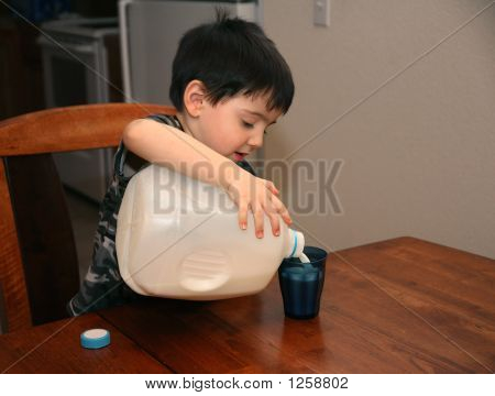 Three Year Old Pouring Milk