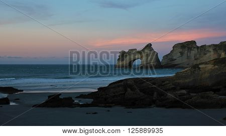 Sunset at Wharariki Beach. Beautiful landscape on the South Island of New Zealand.