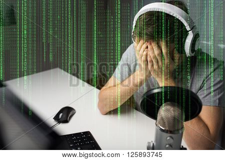 technology, gaming, entertainment, let's play and people concept - close up of sad young man in headset with pc computer failed playing video game and streaming playthrough or walkthrough at home