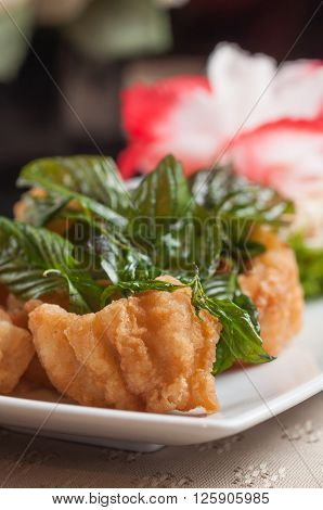 Deep fried fish and crispy basil