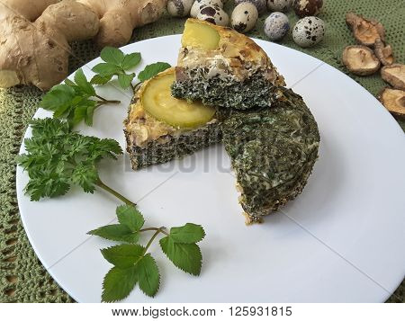 Goutweed squash with mushrooms omelet on plate, Cooking with ginger, wild plants and quail eggs