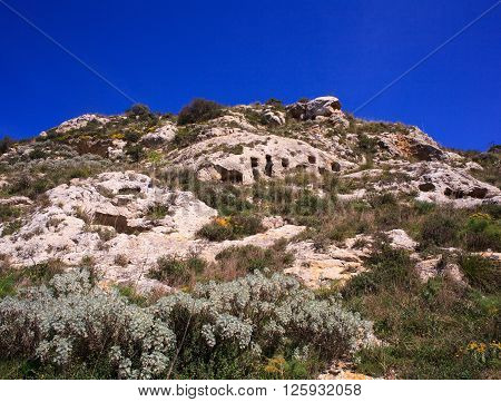 View of the Necropolis of Realmese. Necropoli Pantalicana is an achaeological park in Calascibetta Sicily