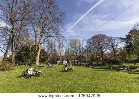 People Enjoy Relaxing In The Outdoor Area Of The  Palmengarten In Frankfurt.