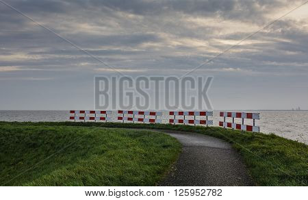 Road fence on the bike path near the sea.