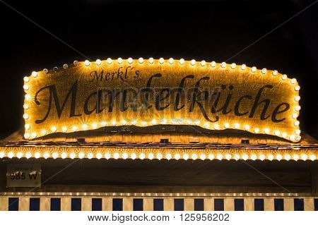 MUNICH, GERMANY - SEPTEMBER 18, 2015: Nightshot of the Merkel's Mandelkueche stall on Theresienwiese