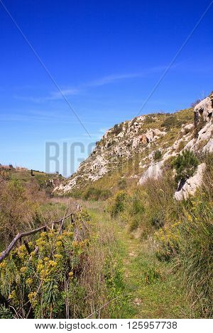 View of the Necropolis of Realmese. Necropoli Pantalicana is an achaeological park in Calascibetta Sicily