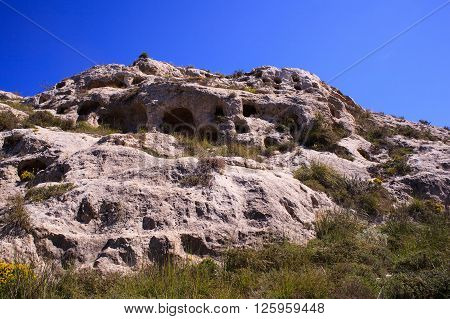 View of the Necropolis of Realmese. Necropoli Pantalicana is an achaeological park in Calascibetta Sicily