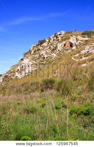 View of the Necropolis of Realmese. Necropoli Pantalicana is an achaeological park in Calascibetta Sicily