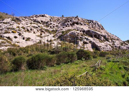 View of the Necropolis of Realmese. Necropoli Pantalicana is an achaeological park in Calascibetta Sicily
** Note: Soft Focus at 100%, best at smaller sizes