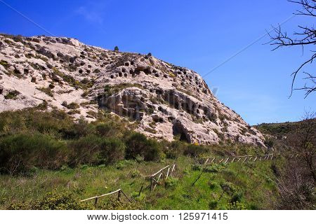 View of the Necropolis of Realmese. Necropoli Pantalicana is an achaeological park in Calascibetta Sicily