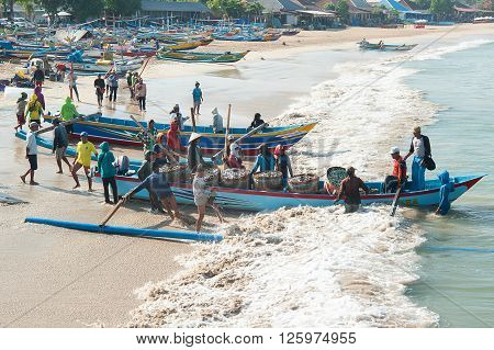 Bali Indonesia Apr 5 2016 : Morning scene of daily activities at Jimbaran village pictured on Apr 5 2016 in Bali Indonesia. Jimbaran village is among famous place to see fisherman life in Bali.