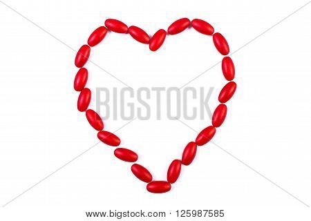 Heart shaped red medical pills capsules or supplements for therapy