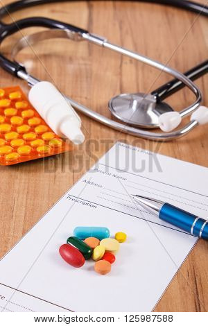Medical pills tablets or supplements for therapy prescription and stethoscope,  concept of treatment and health care