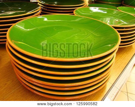Shining Green Soup Plates in a Warehouse