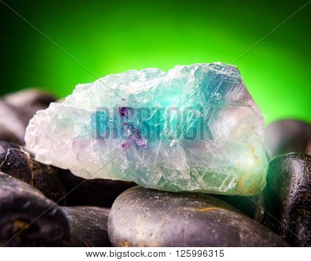 Fluorite also called fluorspar natural crystal on amethyst rock