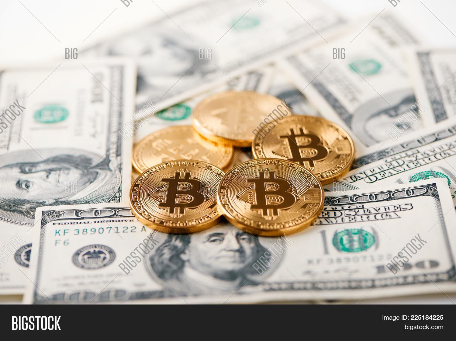 Shiny Golden Bitcoins Image Photo Free Trial Stock Shiny Golden Bitcoins Lying On Hundred Dollar Bills Presenting Gest Cryptocurrency And New Futuristic Form Of