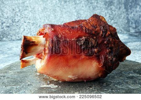 Roasted pork knuckle. Ham and bacon are popular foods in the west. German Schweinshaxe or Haxe
